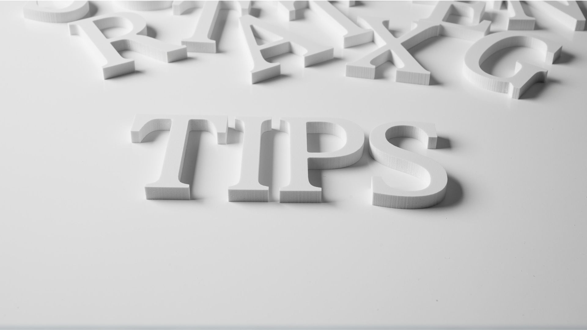 White 3D letters spelling 'TIPS' on a clean background, representing guidance and advice