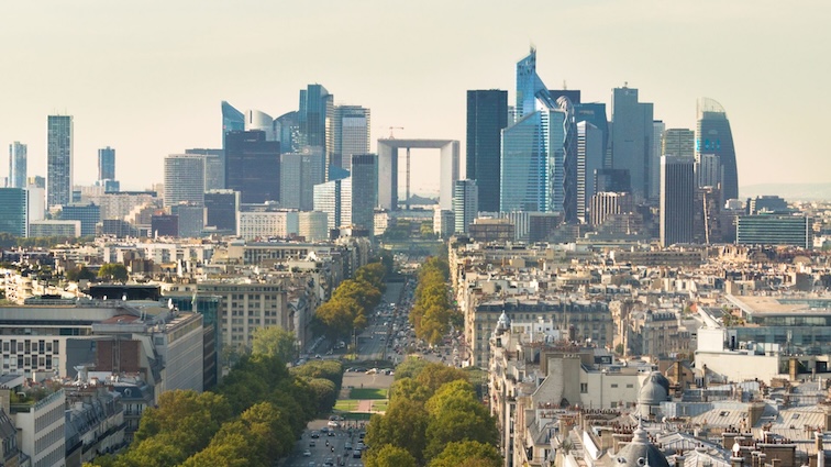 A panoramic view of La Défense, Paris' business district, featuring modern skyscrapers and the iconic Grande Arche