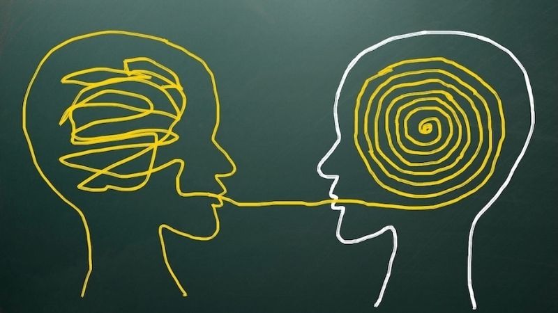 Drawing of two human heads sharing a communication thread