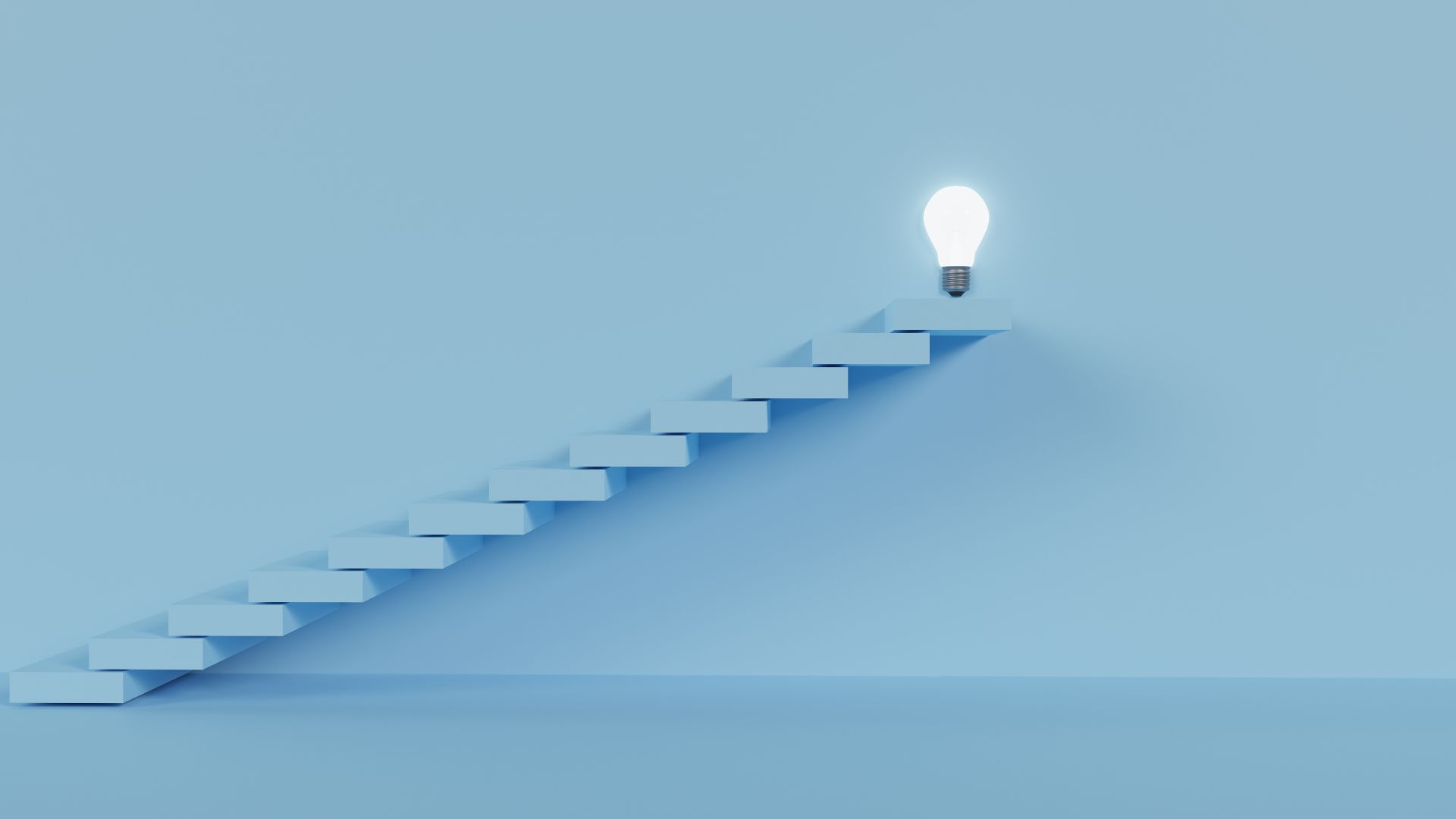 A glowing lightbulb at the top of a blue staircase, symbolizing progress and strategic thinking